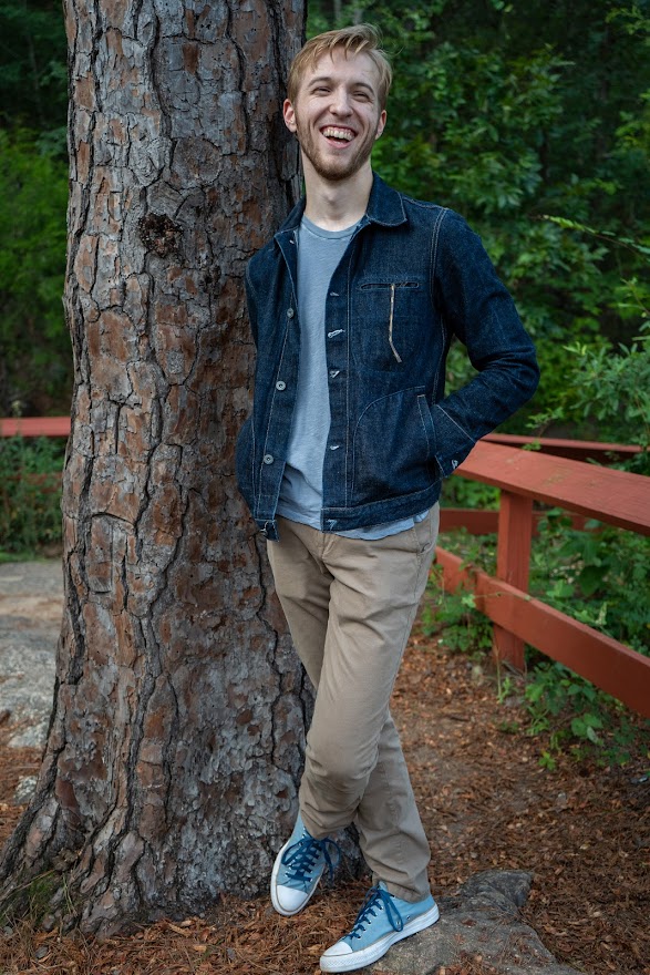 Chris in front of a tree