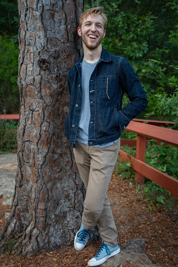 Chris in front of a tree
